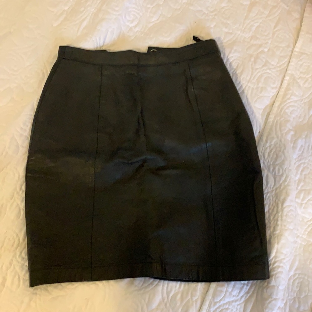 Wilson’s black leather skirt.